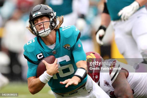 Trevor Lawrence of the Jacksonville Jaguars is sacked by Jonathan Allen of the Washington Commanders during the first quarter at FedExField on...