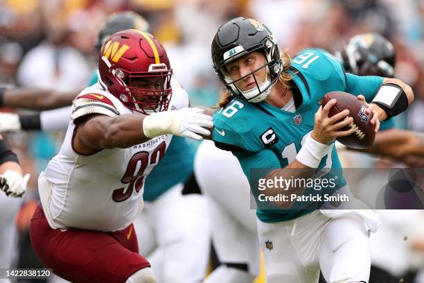 Trevor Lawrence of the Jacksonville Jaguars is sacked by Jonathan Allen of the Washington Commanders during the first quarter at FedExField on...