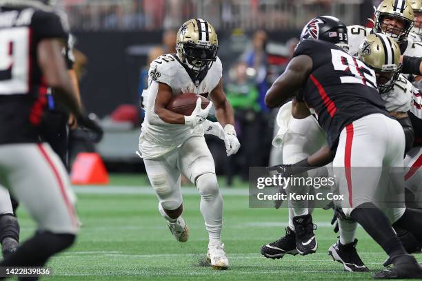 Running Back Mark Ingram of the New Orleans Saints runs the ball during the first half against the Atlanta Falcons at Mercedes-Benz Stadium on...