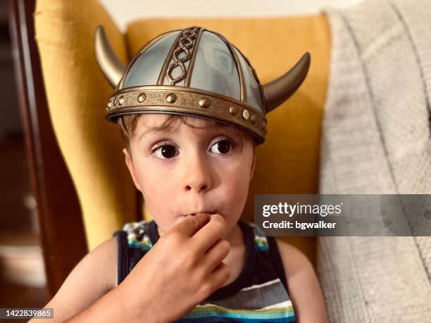 little boy with viking helmet costume - traditional helmet stock pictures, royalty-free photos & images