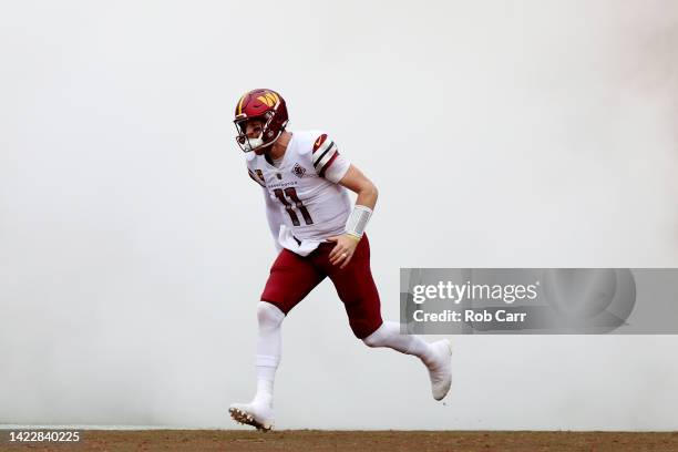 Carson Wentz of the Washington Commanders takes the field prior to the game against the Jacksonville Jaguars at FedExField on September 11, 2022 in...