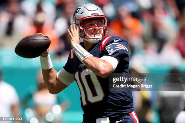 Mac Jones of the New England Patriots looks to pass during the first quarter against the Miami Dolphins at Hard Rock Stadium on September 11, 2022 in...