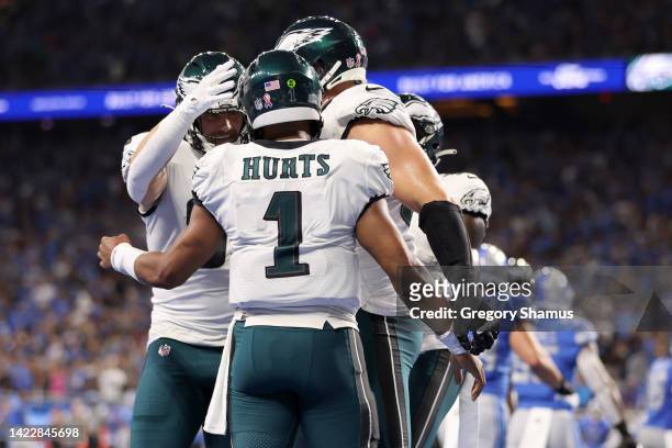 Jalen Hurts of the Philadelphia Eagles celebrates with teammates after scoring a touchdown during the second quarter against the Detroit Lions at...