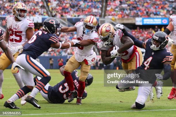 Wide receiver Deebo Samuel of the San Francisco 49ers runs over safety Eddie Jackson of the Chicago Bears while scoring a touchdown during the second...