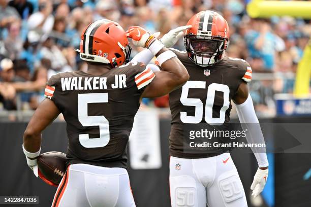 Anthony Walker Jr. #5 of the Cleveland Browns and Jacob Phillips celebrate a defensive play during the second quarter against the Carolina Panthers...