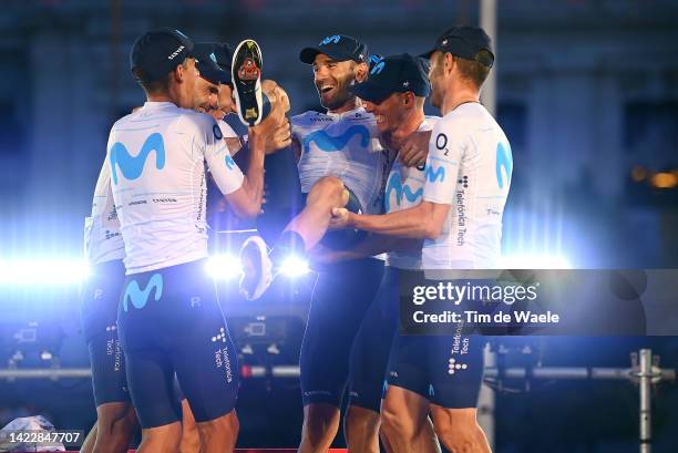 Alejandro Valverde Belmonte of Spain and Movistar Team celebrates with his teammates tribute to his farewell to the professional cycling on the...