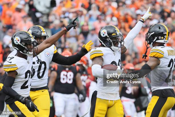 Cornerback Cameron Sutton of the Pittsburgh Steelers celebrates with teammates after an interception during the first quarter against the Cincinnati...