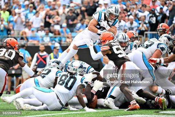 Christian McCaffrey of the Carolina Panthers leaps for a touchdown during the second quarter against the Cleveland Browns at Bank of America Stadium...