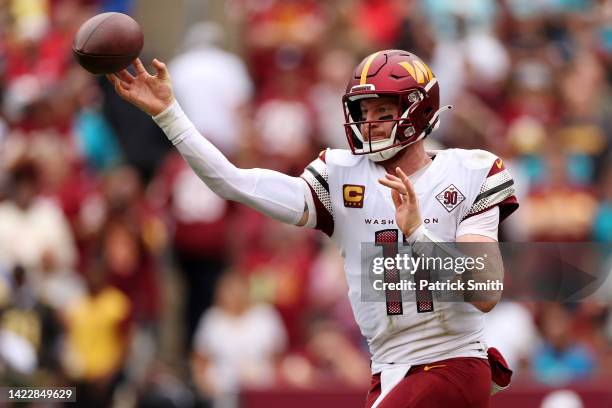 Carson Wentz of the Washington Commanders throws a pass during the first half against the Jacksonville Jaguars at FedExField on September 11, 2022 in...