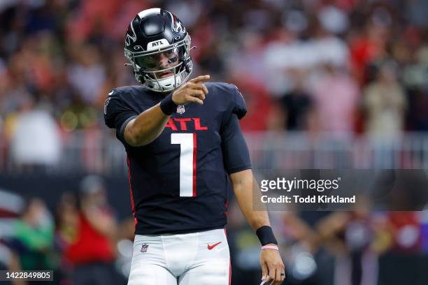 Quarterback Marcus Mariota of the Atlanta Falcons points during the first half against the New Orleans Saints at Mercedes-Benz Stadium on September...