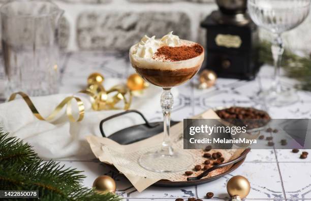 christmas drink cocktail espresso martini white russian with cream on festive table - cocktail counter stock pictures, royalty-free photos & images