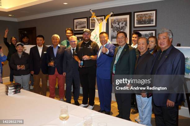 Shane Lowry of Ireland poses for a photograph alongside Dr Chanchai Ruayrungruang, Chairman of the Reignwood Group and Keith Pelley, CEO of The...