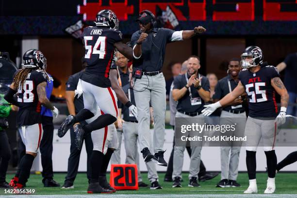 Linebacker Rashaan Evans of the Atlanta Falcons celebrates which a coach during the second half against the New Orleans Saints at Mercedes-Benz...