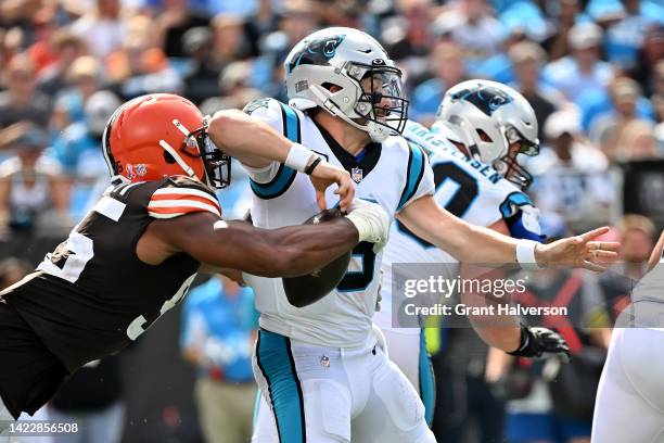 Myles Garrett of the Cleveland Browns strip sacks Baker Mayfield of the Carolina Panthers during the third quarter at Bank of America Stadium on...