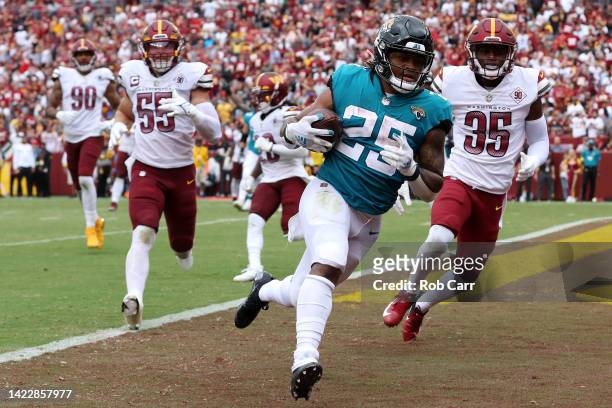 James Robinson of the Jacksonville Jaguars scores a touchdown during the third quarter against the Washington Commanders at FedExField on September...