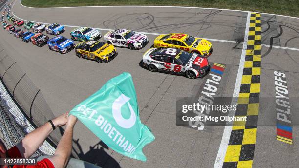 Tyler Reddick, driver of the Guaranteed Rate Chevrolet, leads the field to the green flag to start the NASCAR Cup Series Hollywood Casino 400 at...