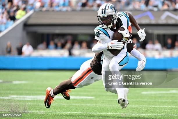 Shi Smith of the Carolina Panthers is tackled by Jacob Phillips of the Cleveland Browns during the fourth quarter at Bank of America Stadium on...