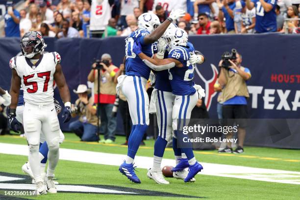 Jonathan Taylor of the Indianapolis Colts celebrates with teammates after scoring a touchdown during the fourth quarter against the Houston Texans at...