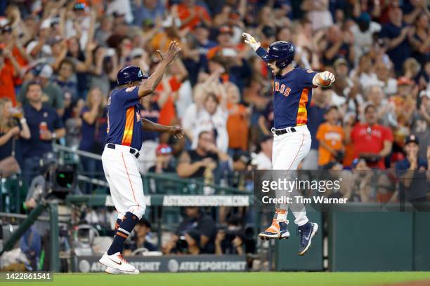 Alex Bregman of the Houston Astros celebrates after hitting a grand slam in the third inning against the Los Angeles Angels at Minute Maid Park on...