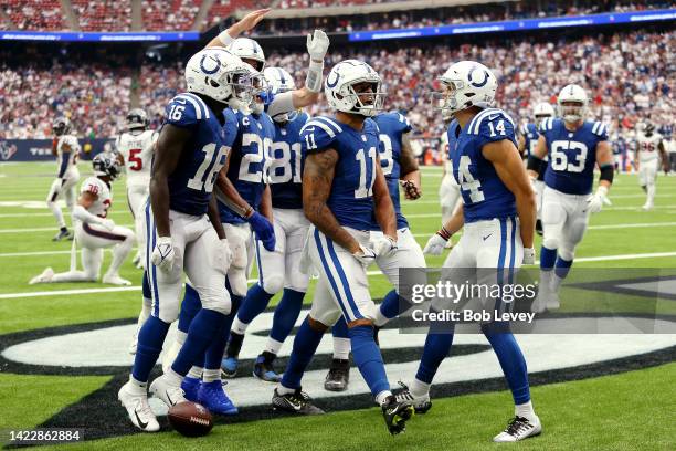 Michael Pittman Jr. #11 of the Indianapolis Colts celebrates with teammates after scoring a touchdown during the fourth quarter against the Houston...