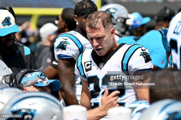 Christian McCaffrey of the Carolina Panthers stands on the sideline during the first quarter against the Cleveland Browns at Bank of America Stadium...