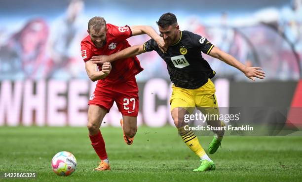 Konrad Laimer of Leipzig is challenged by Salih Ozcan of Dortmund during the Bundesliga match between RB Leipzig and Borussia Dortmund at Red Bull...