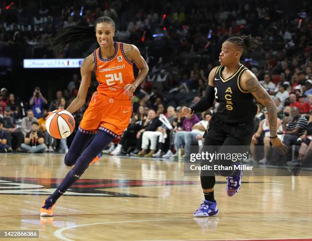 DeWanna Bonner of the Connecticut Sun drives against Riquna Williams of the Las Vegas Aces in the second quarter of Game One of the 2022 WNBA...