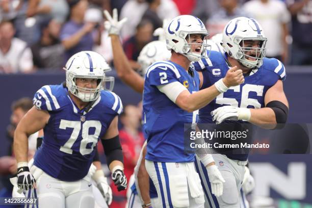 Matt Ryan of the Indianapolis Colts celebrates after throwing a touchdown pass to Michael Pittman Jr. #11 of the Indianapolis Colts during the fourth...