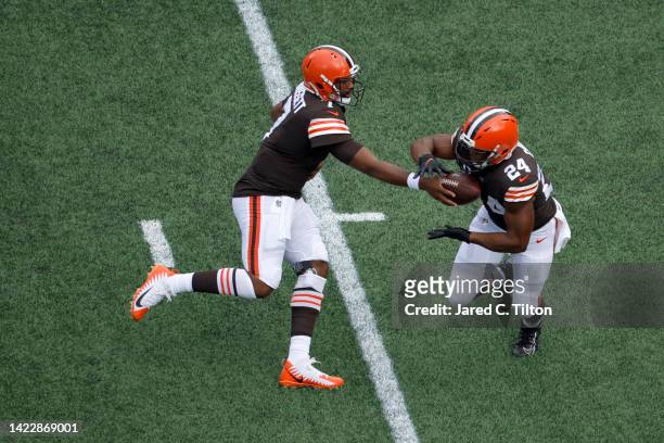 Jacoby Brissett of the Cleveland Browns hands off to Nick Chubb during the first quarter against the Carolina Panthers at Bank of America Stadium on...