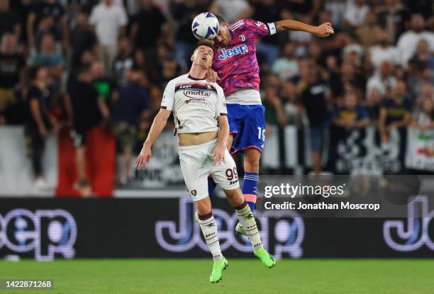 Leonardo Bonucci of Juventus jumps for the ball with Krzysztof Piatek of Salernitana during the Serie A match between Juventus and Salernitana at on...