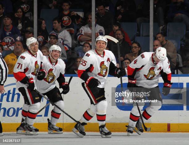 Nick Foligno, Bobby Butler, Sergei Gonchar and Chris Phillips of the Ottawa Senators skate to the bench following Foligno's second period goal...