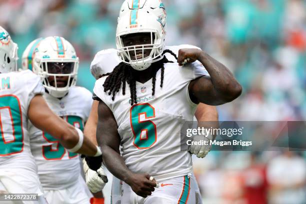 Noah Igbinoghene of the Miami Dolphins celebrates after making a tackle during the second quarter agains the New England Patriots at Hard Rock...