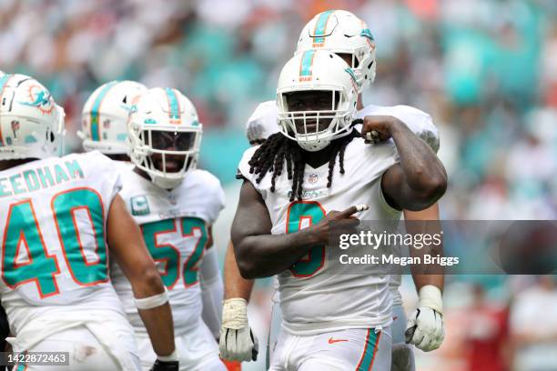 Noah Igbinoghene of the Miami Dolphins celebrates after making a tackle during the second quarter agains the New England Patriots at Hard Rock...