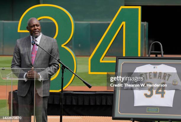 Former Oakland Athletics pitcher Dave Stewart speaks to the fans during the retirement of his jersey number by the Athletics prior to the game...