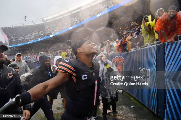 Quarterback Justin Fields of the Chicago Bears celebrates with fans after his team's 19-10 win against the San Francisco 49ers at Soldier Field on...