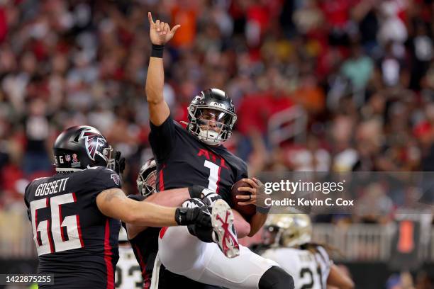 Quarterback Marcus Mariota of the Atlanta Falcons celebrates a rushing touchdown during the third quarter against the New Orleans Saints at...