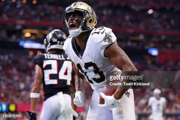Wide receiver Michael Thomas of the New Orleans Saints yells after scoring a touchdown during the fourth quarter against the Atlanta Falcons at...