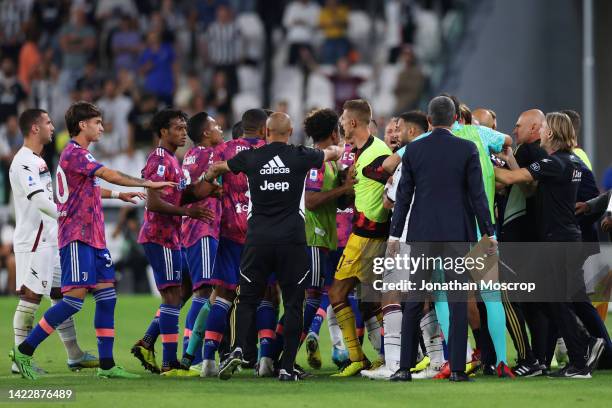 Players of Juventus and Salernitana clash after Arkadiusz Milik of Juventus scored a goal which was later disallowed during the Serie A match between...