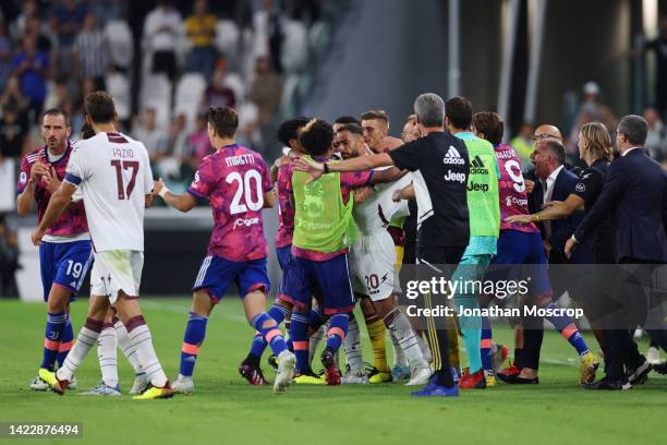 Players of Juventus and Salernitana clash after Arkadiusz Milik of Juventus scored a goal which was later disallowed during the Serie A match between...