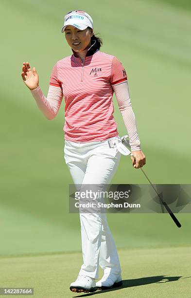 Hee Kyung Seo of South Korea waves after just missing a long eagle putt attempt on the second hole during the final round of the Kraft Nabisco...