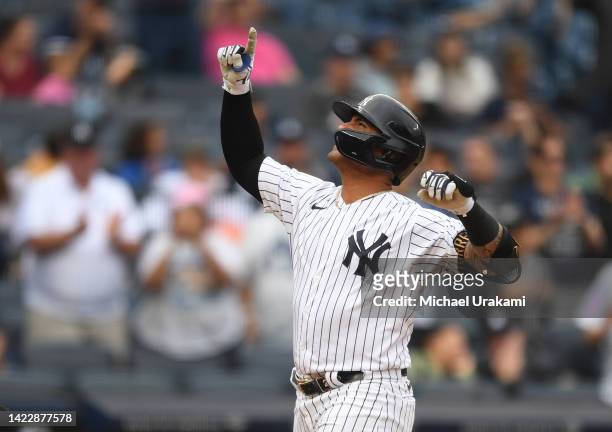 Gleyber Torres of the New York Yankees celebrates as he crosses home after connecting for his second home run of the day during the bottom of the...