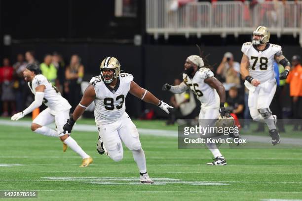 Defensive tackle David Onyemata of the New Orleans Saints celebrates a blocked game winning field goal during the fourth quarter against the Atlanta...