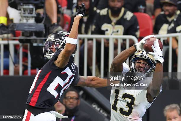 Wide receiver Michael Thomas of the New Orleans Saints catches a touchdown over cornerback A.J. Terrell of the Atlanta Falcons during the fourth...