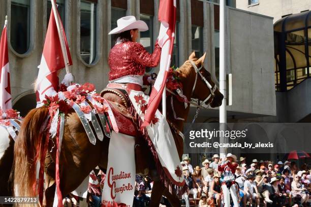 canadian cowgirls- rodeo drill team in the calgary stampede parade 2 - calgary stampede stock pictures, royalty-free photos & images