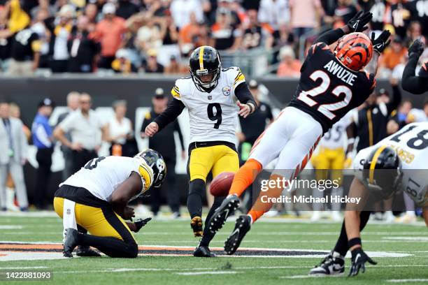 Place kicker Chris Boswell of the Pittsburgh Steelers kicks a game winning field goal past cornerback Chidobe Awuzie of the Cincinnati Bengals during...