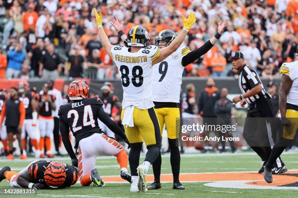 Tight end Pat Freiermuth of the Pittsburgh Steelers and place kicker Chris Boswell of the Pittsburgh Steelers celebrate Boswell's game winning kick...