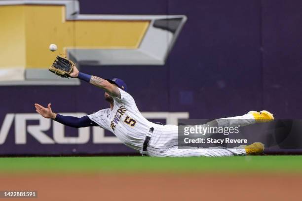 Garrett Mitchell of the Milwaukee Brewers fields a fly ball during the ninth inning against the Cincinnati Reds at American Family Field on September...