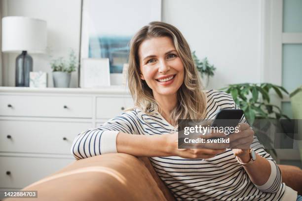 mature woman at home - beautiful woman 40s stock pictures, royalty-free photos & images