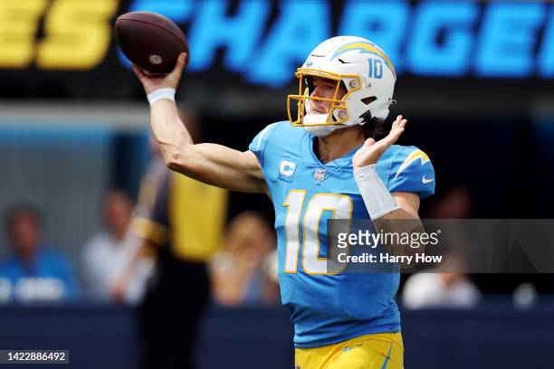Quarterback Justin Herbert of the Los Angeles Chargers attempts a pass during the first half against the Las Vegas Raiders at SoFi Stadium on...