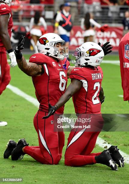 Running back James Conner and wide receiver Marquise Brown of the Arizona Cardinals react during the first half of the game against the Kansas City...